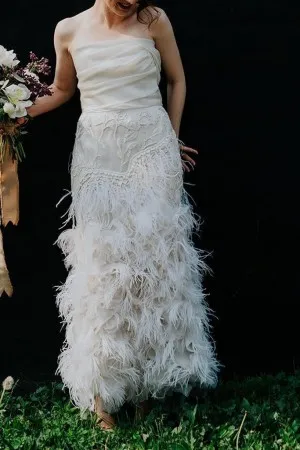 Beautiful draped ivory ostrich feather bridal gown