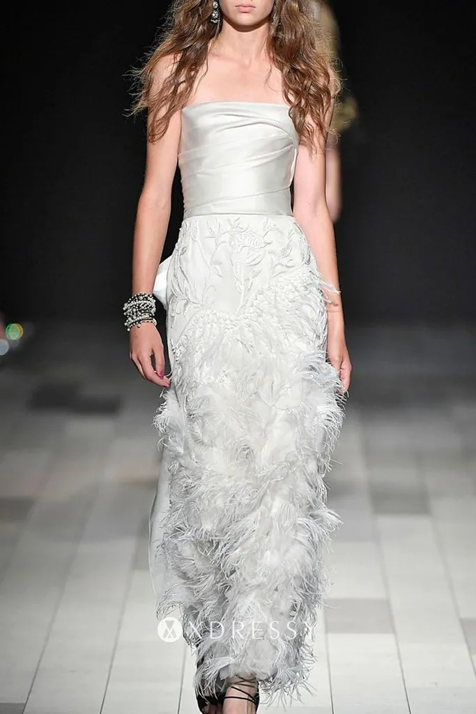 Draped ivory organza strapless sheath long bridal dress with ostrich feather cascading down skirt Draped ivory organza strapless sheath long bridal dress with ostrich feather cascading down skirt