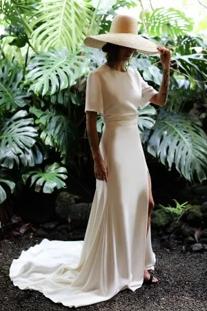 ivory satin short sleeve keyhole back modern bridal gown