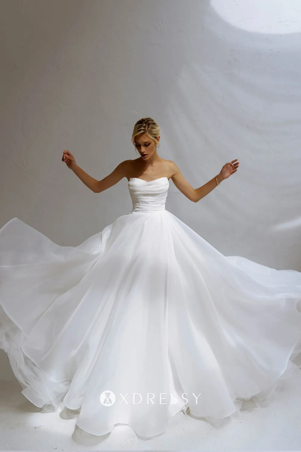 modern strapless pleated ivory organza bridal gown
