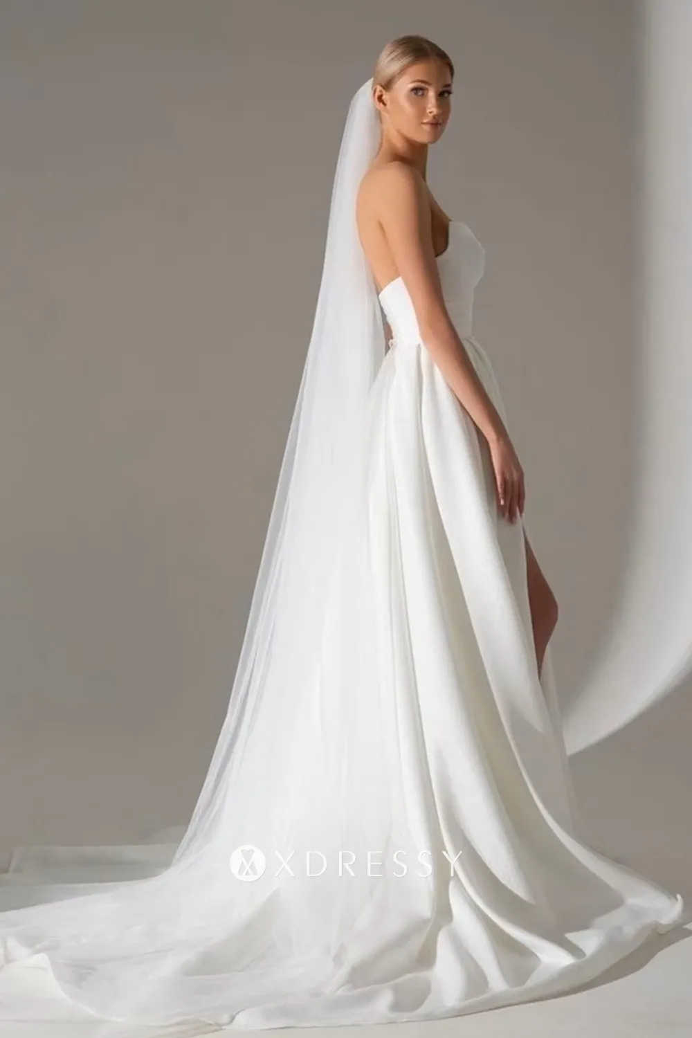 ivory satin low back bridal gown with a court train