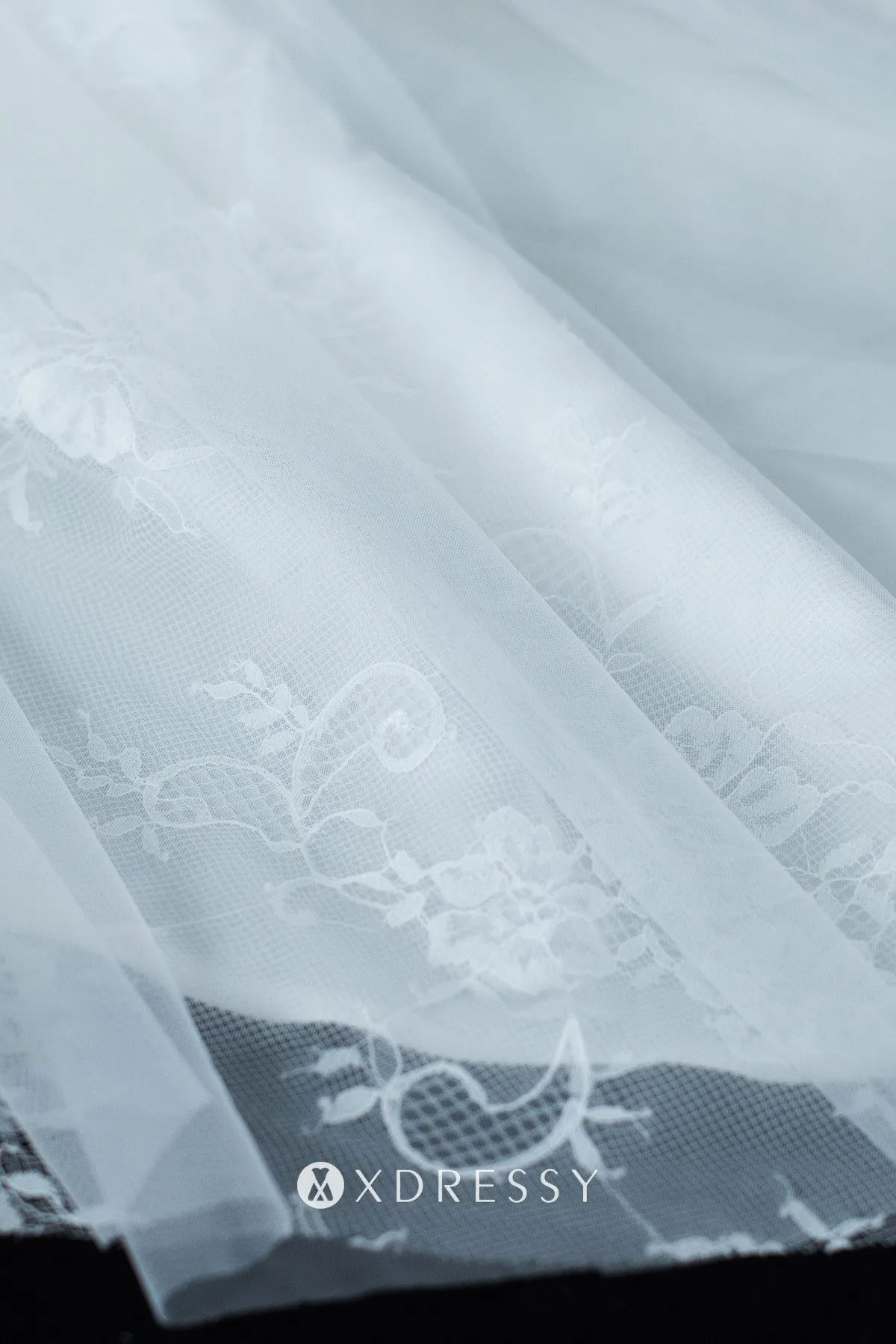 white lace and tulle chapel train white bridal gown